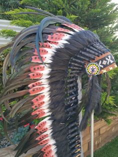 Long Indian Headdress Replica made with Brown Swan feathers and Rooster feathers beaded work in the front This great adult headdress is entirely handmade and truly adorable. Perfect photography prop for your special ocasion. Ties in the back for a perfect fit. This will be precious for your costume, or even room decor. Head circumference: 59 centimeters / 23 inches ✈️ Worldwide shipping 🐤 I only use authentic feathers ⛺️ I guarantee highest quality, 100% hand-crafted Ostrich Feather Trim Headpieces For Festivals, Festival Ostrich Feather Trim Headpiece, Festival Headpiece With Ostrich Feather Trim, Swan Feathers, Perfect Photography, Beaded Work, Black Rooster, Indian Headdress, Rooster Feathers