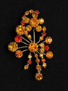 Here you have a beautiful amber rhinestone spray brooch.  This brooch has amber, orange, and rust colored rhinestones and is just beautiful.  This brooch has a secure safety clasp.  There are no missing rhinestones.  There is age appropriate wear - the pin is slightly bent as seen in picture 10.    Dimensions:  2-1/2" across x 1-1/2" across SKU:  25062 Oregon City, Just Beautiful, Rust Color, Brooch Pin, Brooches, Oregon, Amber, Rust, Gold Tones