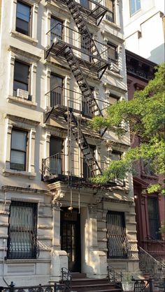 an apartment building with a fire escape next to it