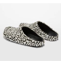 Rhinestone-encrusted flat mule slippers designed for outdoor wear. Featuring a luxurious leather inner and durable rubber sole, these slides are both stylish and comfortable. The delicate bling adds a touch of glamour, making them perfect for a chic day out. Please handle with care to maintain the shine and integrity of the rhinestones. Sizes are in Women's. Rhinestone Slides, Leather Fits, Womens Active Wear Outfits, Basic Heels, Designer Slippers, Heel Caps, Head Design, Elegant Shoes, Outdoor Wear