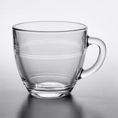 a glass cup sitting on top of a table