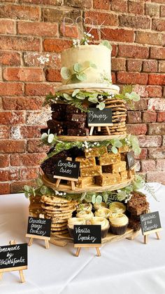 a cake and cupcakes are stacked on top of each other