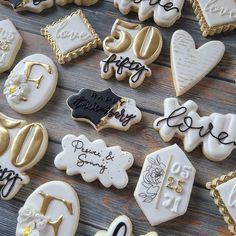 decorated cookies are arranged on a table for someone's 50th birthday party or special occasion