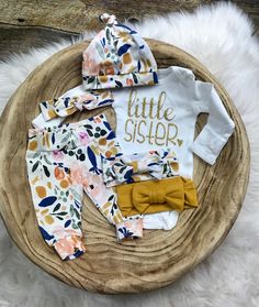 "This gorgeous coming home set features Watercolor Floral joggers, Little Sister bodysuit, and choice of headpiece. Made from breathable, organic cotton, ethically sourced fabric, and is buttery soft! Joggers are elastic-free, perfect for baby's growing tummies, boutique-quality & handmade in Iowa, USA! This set includes your choice of all pieces, or any combination of the following: pants only, bodysuit only, bodysuit + headpiece, Pants + headpiece, or Pants, bodysuit + headpiece. Bodysuit Fitted Cotton Sets For Coming Home, Cotton Fitted Coming Home Outfit Sets, White Cotton Coming Home Outfit Sets, White Cotton Sets With Matching Headband, Coming Home Outfit Baby Girl, Baby Hospital Outfit, Girl Coming Home Outfit, Floral Joggers, Outfit Baby Girl