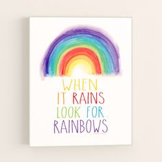 a rainbow with the words when it rains, look for rainbows on it's side