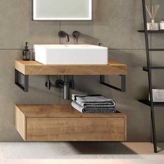 a bathroom with a sink, mirror and shelves