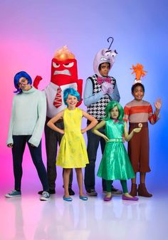 five children in costumes posing for a photo