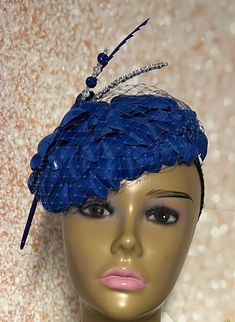 Royal Blue Flower Fascinator Half Hat for Church head covering, Tea Party, Wedding, and other Special Occasions  Accented with blue veil netting, rhinestone hat pin, feather and faux pearl. The hat pin may vary and is for decorative purposes only. The hat is affixed to the head via a hat string. Available in 2 sizes: 8 X 5.5 inches  10 X 7 inches Mannequin is wearing the 8 by 5.5 inches. Handmade Gifts for mom, sister, wife, or yourself. SHIPPING  All items for free shipping will be shipped via Blue Mini Hats With Handmade Flowers For Royal Ascot, Blue Spring Headpieces For Events, Elegant Blue Fascinator With Handmade Flowers, Blue Hats With Handmade Flowers For Kentucky Derby, Blue Headpieces For Spring Events, Elegant Blue Headpiece With Handmade Flowers, Summer Blue Headpiece With Handmade Flowers, Spring Blue Mini Hats With Handmade Flowers, Blue Hair Accessories For Evening