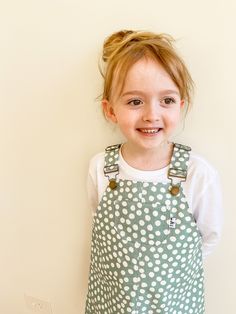 Handmade girls pinafore. Pretty girls drill cotton pinafore!  Pockets at the back, and one at the front for life's little treasures!  Overall buckle fastenings on the straps.  Very comfortable - oh and also super cute  xx Made from beautiful 100% cotton light weight drill fabric.  Base colour is lagoon green. * Sizes 3 to 8 available for order Please note these pinafores are made to order.  Please allow 2 weeks for your custom order to be made x Cute Cotton Bib Front Overalls, Cute White Cotton Pinafore Dress, Girls Pinafore, Kids Overalls, Granddaughter Birthday, Handmade Clothing, Style Expert, Girls Clothes, Handmade Clothes