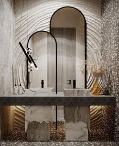 a bathroom with two sinks and mirrors on the wall above it is an art deco design