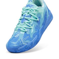 a blue tennis shoe on a white background