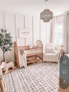 a baby's room with a crib and rocking chair