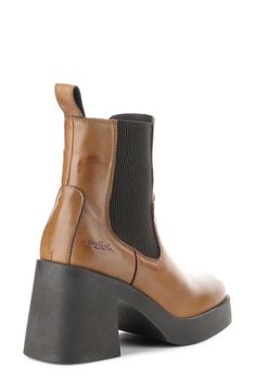 A chunky platform and block heel add scene-stealing height to a waterproof leather bootie fitted with a goring side panel for easy wear. Waterproof: protects against rain, puddles and slush to keep feet dry in wet conditions 3 1/2" heel; 1" platform 5 1/4" shaft Side zip closure with elastic gore inset Memory foam cushioning Leather and textile upper/textile lining/rubber sole Made in Portugal Chunky Platform, Leather Booties, Easy Wear, Panel Siding, Bootie, Side Zip, Veil, Block Heels, Memory Foam