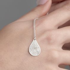 "Tear Drop Fingerprint Necklace, Engraved Fingerprint Jewelry in Sterling Silver is made by hand in our workshop with care. All our jewelry is the most elegant choice for the Bridesmaids, friends, your loved ones and for yourself. Tear Drop Fingerprint Necklace, Engraved Fingerprint Jewelry in Sterling Silver * Material: High Quality Solid 925 Sterling Silver. * Finish: Sterling Silver ∙ Gold ∙ Rose Gold. * All our jewelry is custom made by hand with care in our workshop.  HOW TO ORDER ❓ * Select your necklace COLOR and ENGRAVE SIDES (Messages can be engraved on both sides). * Choose necklace length from 14\" to 22\". The length option is the TOTAL chain length (including the charm). If you order an 18\" chain, the piece will come as CHAIN + CHARM = 18\".  * You can acquire fingerprint ink Minimalist Etched Jewelry For Keepsake, Silver Memorial Jewelry Laser Engraved, Teardrop Engraved Jewelry Gift, Engraved Teardrop Jewelry For Gift, Fingerprint Necklace, Memorial Pendant, Fingerprint Jewelry, Engraved Necklace, Silver Material