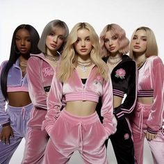 four women in pink and purple outfits posing for a photo together with one woman's head tilted to the side