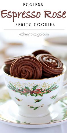 a cup filled with chocolate rolls on top of a saucer