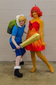 two people in costumes posing for the camera