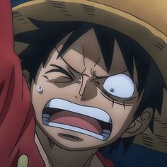 a man with an evil look on his face wearing a straw hat and red scarf