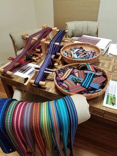 there are many different types of ribbons on the table and one is made out of wood