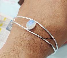 Moonstone Bangle, 925 sterling silver Bangle ,charm link Bangle, silver jewelry, gift for her, Fashion Bangle,Beatiful Bangle Bangles help in maintaining and recharging our energy levels as well. The electricity passing out through the skin is again reverted to our own body because of the ring-shaped bangles. Since bangles are circular in shape there are no ends to pass the energy outside ,and thus the energy is reverted back to the body SStyle:- Bangle Gemstone :- Moonstone Colour:- White (Newj Silver Bracelets With Simple Design For Gift, Silver Bracelets For Gifts, Silver Bracelets Simple Design Gift, Sterling Silver Bangle Bracelet With Simple Design, Sterling Silver Bracelet With Simple Design For Gifts, Silver Sterling Bracelet Simple Design Gift, Sterling Silver Bracelet Simple Design Gift, Gift Sterling Silver Bracelet With Simple Design, Gift Sterling Silver Bracelet Simple Design