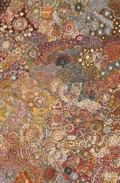 an abstract painting with lots of different colors and patterns on the surface, including circles