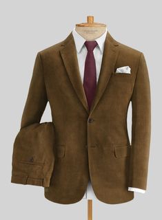 Add texture to your ensemble with our Brown Corduroy Suit. Crafted from cotton, the suit is comfortable and warm, it will mold with the body giving a feeling of reassurance and structure. It characterizes an earthy brown color that is suitable for day to day work as it for an evening out with friends around the town.  Look Includes   Brown Corduroy Fabric 8 Wales  Two Button Jacket Style  Notch Lapel  Horn Brown Buttons  Single Vent  Three Cuff Buttons  Two Welted Back Pockets on Trousers    Click 'Customize Now' to modify the look if needed.   Lining: Viscose; Dry Clean. Corduroy Suit, Grey Wool Suit, Blue Linen Shirt, Brown Corduroy Jacket, Earthy Brown, Cashmere Jacket, Professional Style, Black Dress Shoes, Tweed Suits