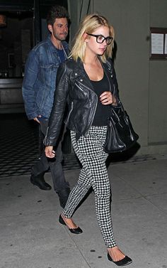 the blonde woman is wearing black and white checkered pants