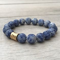 Features Sodalite Brass Charms 10 mm Bead Supports BALANCE SELF-ESTEEM SELF TRUST CALMING Our gemstone beaded bracelets are rare and unique semi precious stones from the Earth, known to hold certain energy. Before they are crafted into beautiful bracelets, the stones are pummeled, shaped, and placed under a full moon to fully charge. These sedimentary stones are porous. When essential oils are applied to the bead, it will last all day. These stones offer an alternative to the popular lava bead. Anklets Diy, Beaded Beads, Beautiful Bracelets, Women's Jewelry Sets, Homemade Jewelry, Gemstone Beaded Bracelets, Brass Charms, Lava Bead, Mens Beaded Bracelets