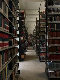 a long row of bookshelves filled with lots of books