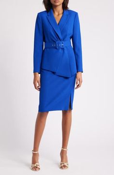 This tailored jacket is designed with a matching belt and a pared-back ruffle, while a simple straight-cut skirt completes the polished look. 25" to 29" jacket length; 24 1/2" center front skirt length (size 8) Jacket has notched lapels; long sleeves Lined 96% polyester, 4% elastane Dry clean Imported Removable belt 2 piece set Blue Long Sleeve Skirt Suit For Office, Tailored Blue Skirt Suit In Chic Style, Formal Blue Belted Outerwear, Fitted Blazer With Belt Detail For Work, Chic Blue Formal Skirt Suit, Elegant Fitted Blazer With Belt Detail, Elegant Blue Belted Outerwear, Elegant Royal Blue Workwear Blazer, Elegant Royal Blue Blazer For Work