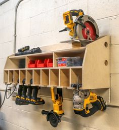 a workbench with tools hanging on the wall