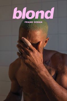 a man covers his face in front of a magazine cover with the word blond on it