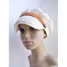 a mannequin head wearing a white crochet hat with brown ribbon around the brim