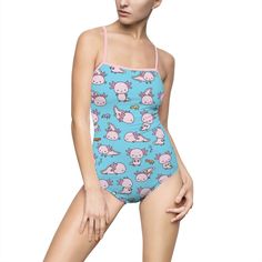 This one piece swimsuit is designed for fashion-conscious swimmers, featuring adorable axolotls on a blue background and pink straps! With 83% nylon and 17% spandex fabric construction, this suit features a hollowed-out backing and an elastic component near the chest area that is designed for extra support. .: 83% Nylon 17% Spandex .: Light fabric (5.01 oz/yd² (169 g/m .: Inch wide elastic at the chest area for extra support .: Cut out at the back .: Elastic straps .: Runs smaller than usual .: Cute One-piece Swimwear For Pool, Cute Blue Swimming Bodysuit, Cute Blue Bodysuit For Swimming, Cute Blue Stretch Swimwear, Cute Stretch Blue Swimwear, Cute Pink Bodysuit For Swimming, Heart Enamel Pin, Fabric Construction, One Piece For Women