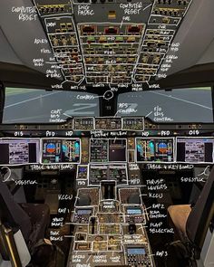 the cockpit area of an airplane with many controls and other information written on it's walls