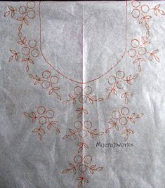 a piece of paper that has been embroidered onto with orange thread and flowers on it