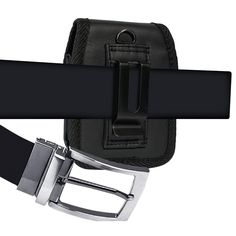 a black belt with metal snap and belt hole on the side, attached to a leather belt