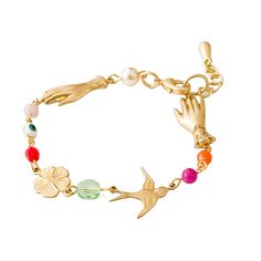 Elevate your wrist game with this enchanting gold Charm Bracelet! Channel some major style with its charmingly wicked eye, spellbinding feathered friend, and blooming flower beads, all crafted with care for maximum playfulness and flair. Wear this adjustable bracelet and your outfit will never be boring again! • Adjustable 7" - 8" • Lobster clasp Nest Pretty Things is designed by Tamar and handmade by a team of wonderful women in their Burlington, Vermont studio. They donate monthly to various c Playful Bracelets For Party, Charm Bracelet Adjustable, Cute Charm Bracelets Not On The High Street, Bloomindale Bracelet, Bracelet Party, Burlington Vermont, Pastel Beads, Wrist Game, Moonstone Crystal