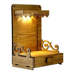 a wooden box with a light on it and some drawers in front of the door