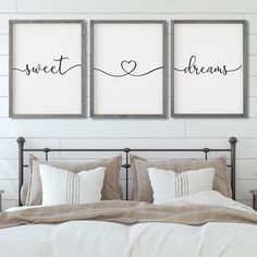 two framed pictures on the wall above a bed