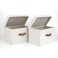 two white storage boxes with brown handles