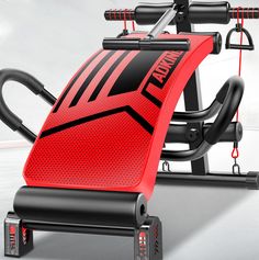 a red and black exercise machine with handles