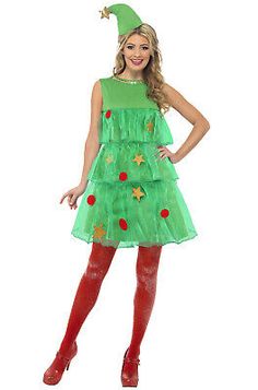 a woman wearing a green dress and red boots