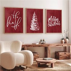 three red and white christmas paintings in a living room