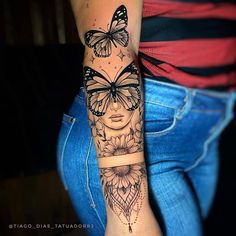 a woman's arm with butterflies and flowers on the side of her body,