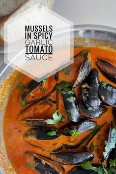 mussels in spicy garlic tomato sauce with bread