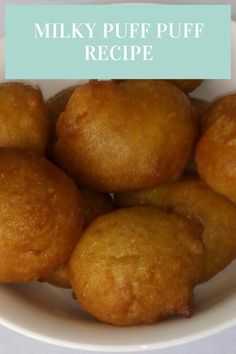 a white bowl filled with fried food on top of a table