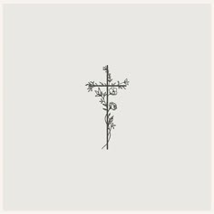 a black and white drawing of a cross with flowers