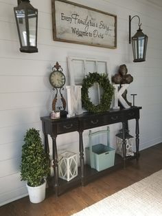 the entryway is decorated with wreaths, lanterns and other items for decorating