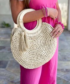 The Summer Adventures Straw Tassel O-Ring Tote is a must-have accessory for your summer adventures. This circular tote is beautifully crafted with a woven design, adding a touch of natural elegance to your look. The tote is spacious enough to hold all your essentials for a day out in the sun.
The tote features two tassels, one on each side, that adds a playful element to the design. The tassels are beautifully crafted with high-quality materials, adding a touch of texture and color to the tote. Trendy Crochet Bag With Tassels For Beach, Spring Beach Bag With Fringe, Beige Tasseled Beach Bag For Summer, Beige Tassel Beach Bag For Summer, Trendy Summer Crochet Bag With Tassels, Casual Summer Crochet Bag With Tassels, Casual Fringe Beach Bag For Vacation, Braided Crochet Bag For Spring And Summer, Spring Summer Braided Crochet Bag